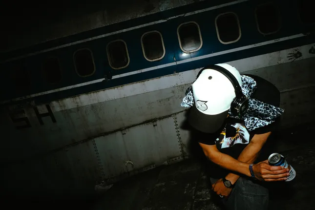 rave in the woods next to a plane